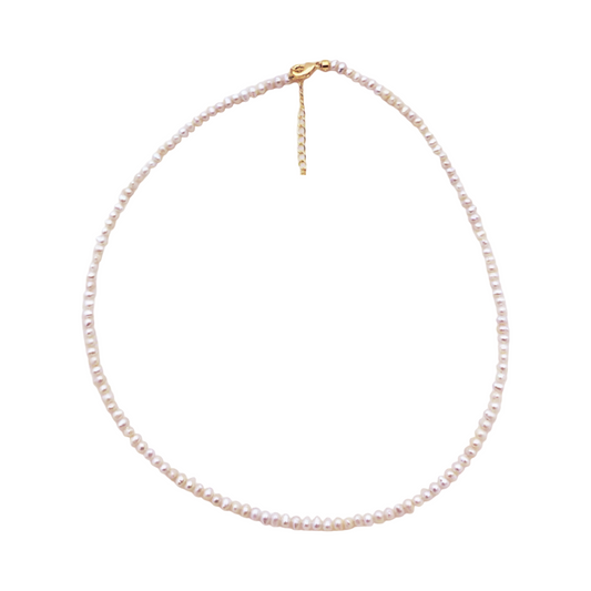 Textured pearl choker, delicate gift for her  
Minimal necklace with round freshwater pearls  
Choker with mixed pearls, handmade and elegant  
Collier perlé fin, doré et fait main  
Cadeau élégant en perles irrégulières  
Matana le’isha – tachshit im perot tiviim  
Tachshit katan, perot l’tsavar  
Natural pearl choker, minimalist layering piece  
Choker perlé doré, idée cadeau femme  
Collier ras de cou perles rondes et baroques