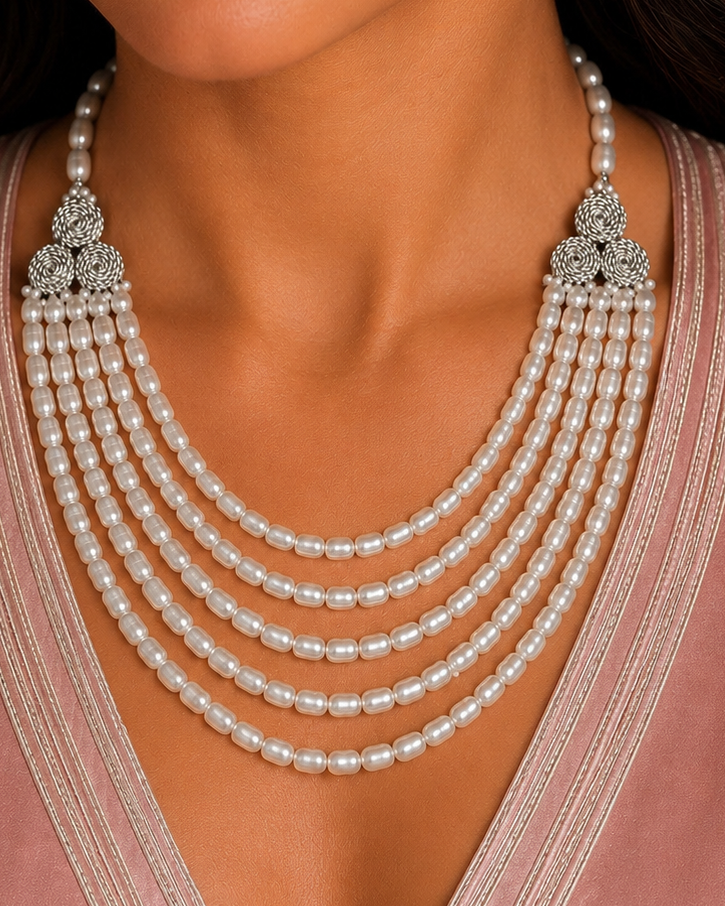 “Silver Atlas Pearl Collar featuring layered freshwater pearls and handwoven Moroccan-inspired cord rosettes by Opal Bazaar.”